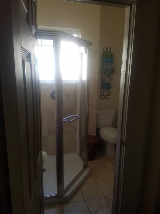 Private Bath with modern standing shower and amenities provided