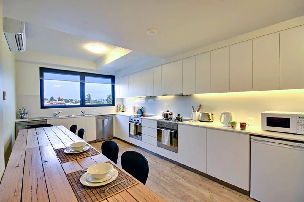 Double sinks, refrigerators,dishwashers, oven, and induction stoves