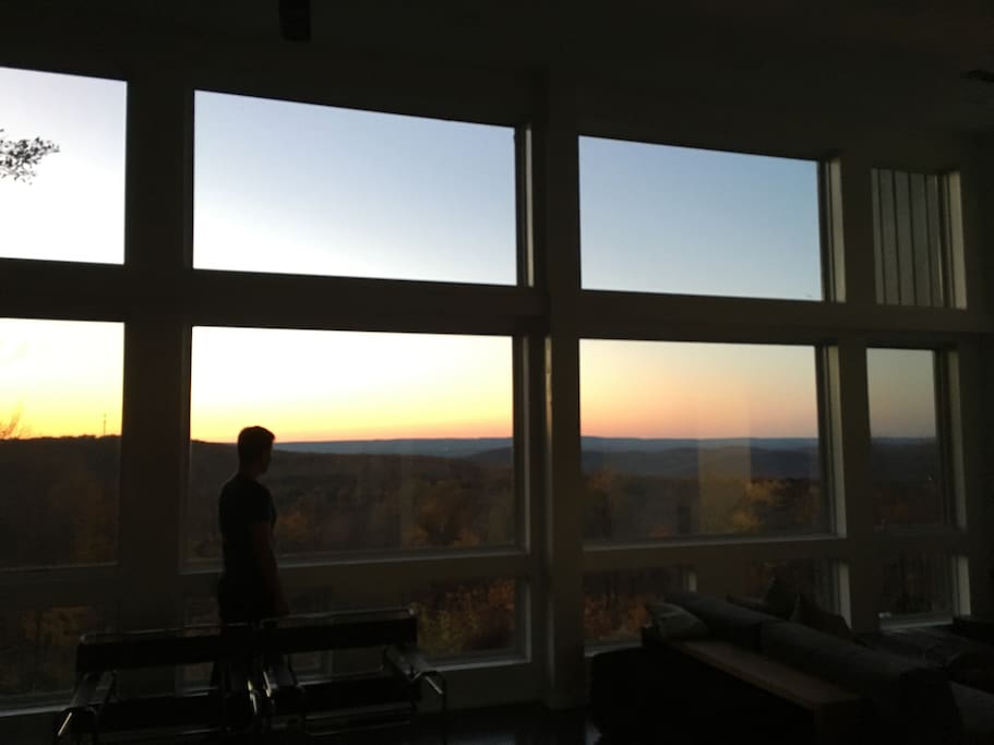 Stunning sunset views from the living room's 14' ceilings and floor to ceiling windows.