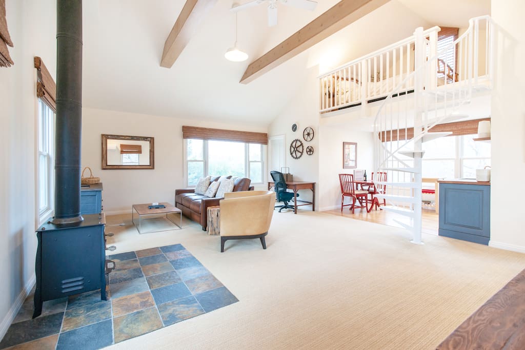 The guest house has ample space, with a loft bed, desk, a kitchenette, dining area, a comfortable sleeper sofa, large walk-in closet, and bathroom.