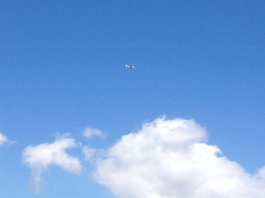 Aero-plane is flying in the sky and International airport is just 15 km from my home