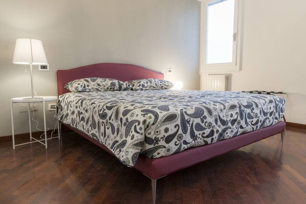 Comfy and elegant bedroom with double bed