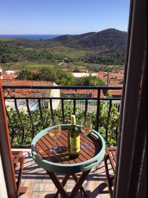 View of the village and the pool from the bedroom balcony.