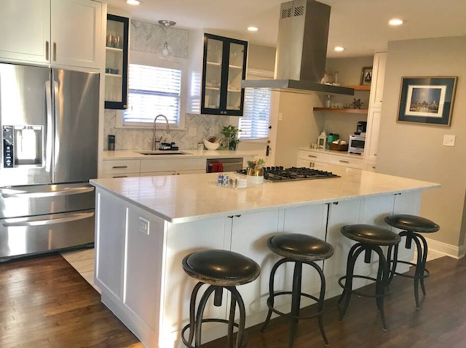 Full Stocked Kitchen with Bar Seating