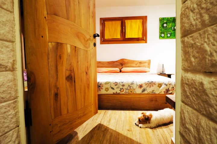 The Garden Room - Both the walnut bed and the interior door are handmade.. beautiful craftsmanship, definitely unique, the line of the fireplace!