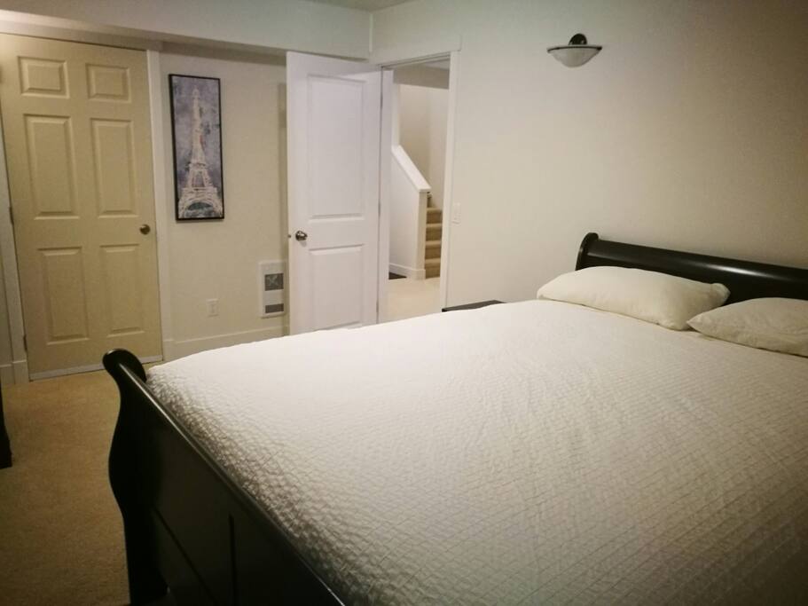 Brand New Bedroom B with a queen size bed, a dresser and two night stands.