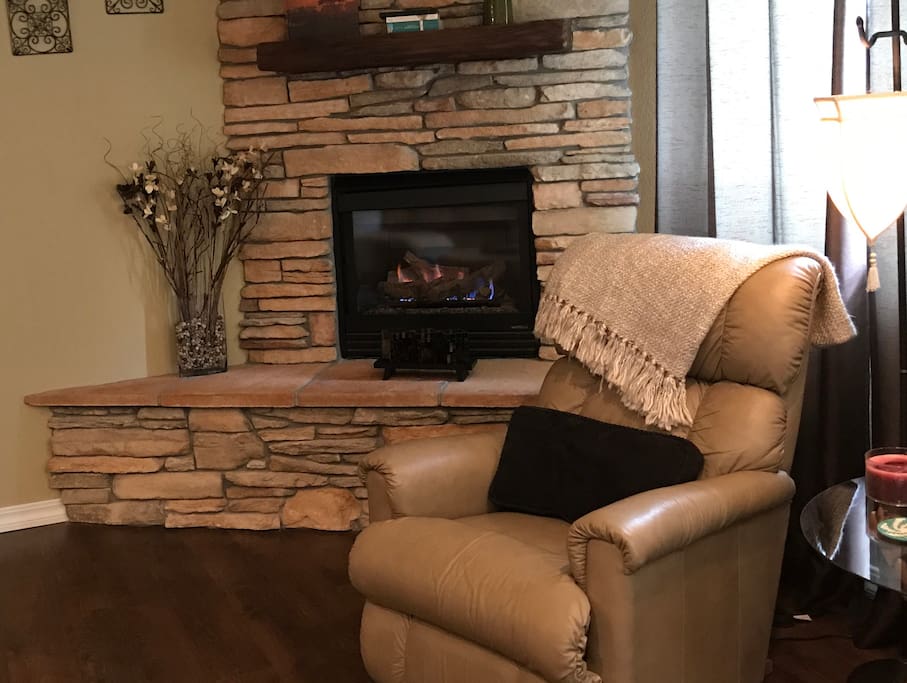 Cozy gas fireplace with blower.