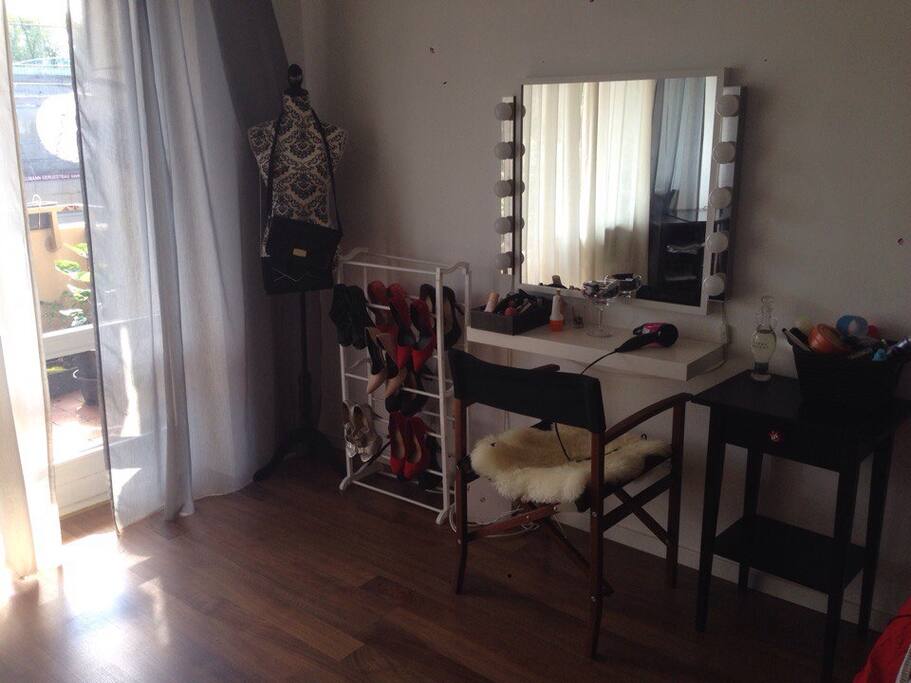 Makeup table with professional lights and a movie director chair