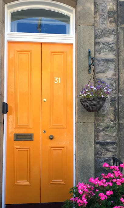Our front door and the energetic geraniums
