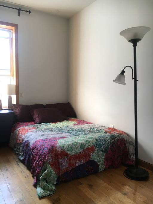 bed and floor lamp