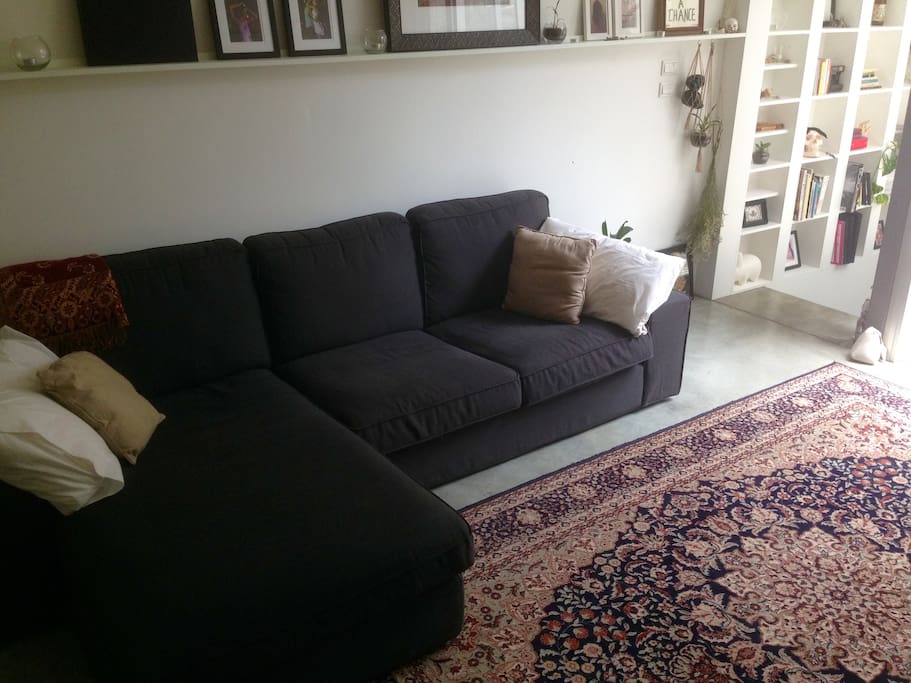 3 Seater couch that can easily accommodate 4 people and can sleep an adult comfortably; (Cushions can be removed to make a bed).