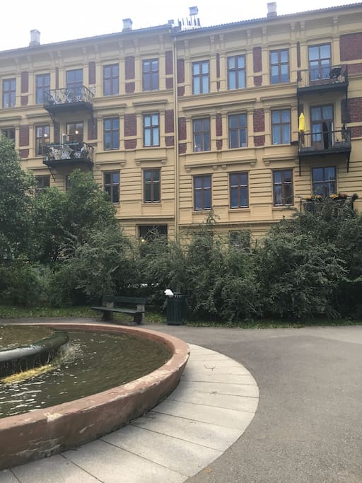 A beautiful fountain outside the apartment.