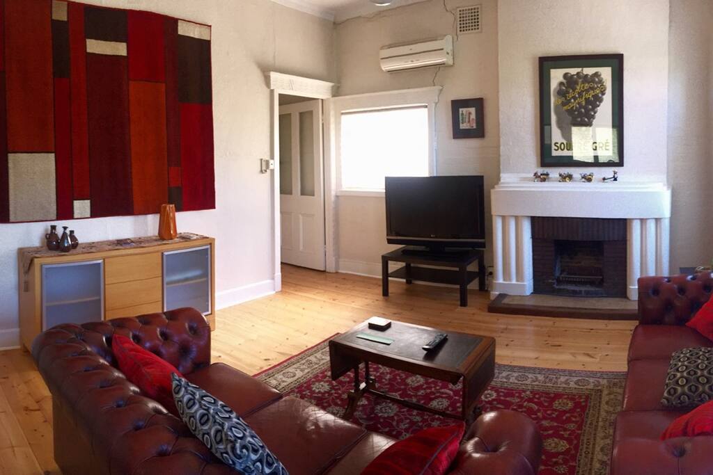 Large reverse cycle airconditioned light-filled lounge with windows on 3 sides to catch the evening breeze if you prefer!