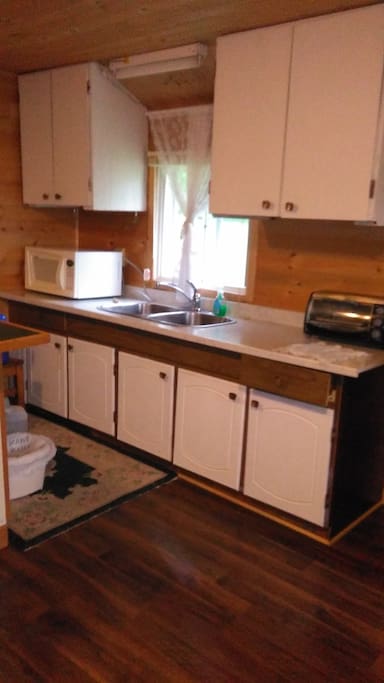 Kitchen sink and cupboards.