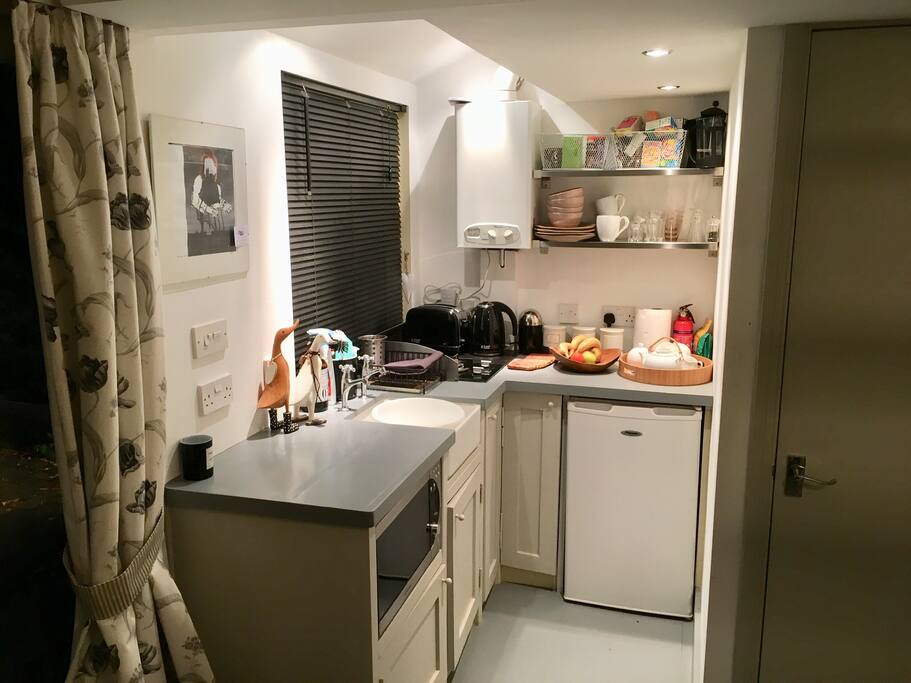 The kitchen with door to the shower room on the right of picture.