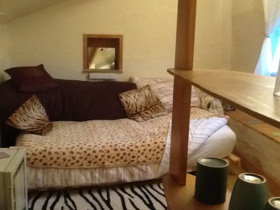 A very comfy sofabed, laid out as both sofa & double-bed (take off the beanbag back-rest).