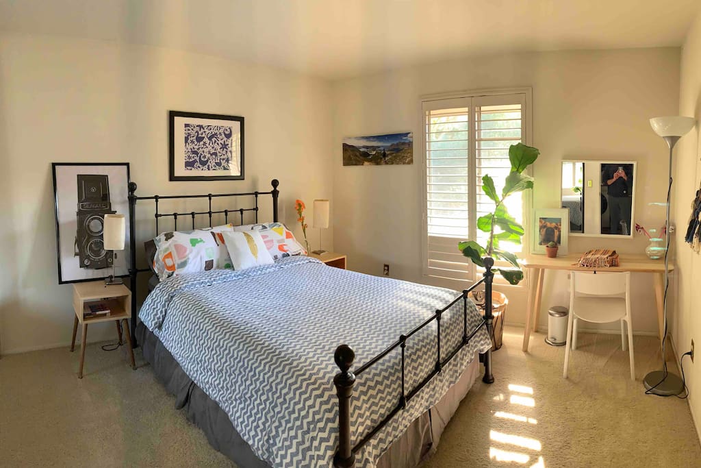 Guest room 1- Queen bed, lots of natural light and overlooks the back patio