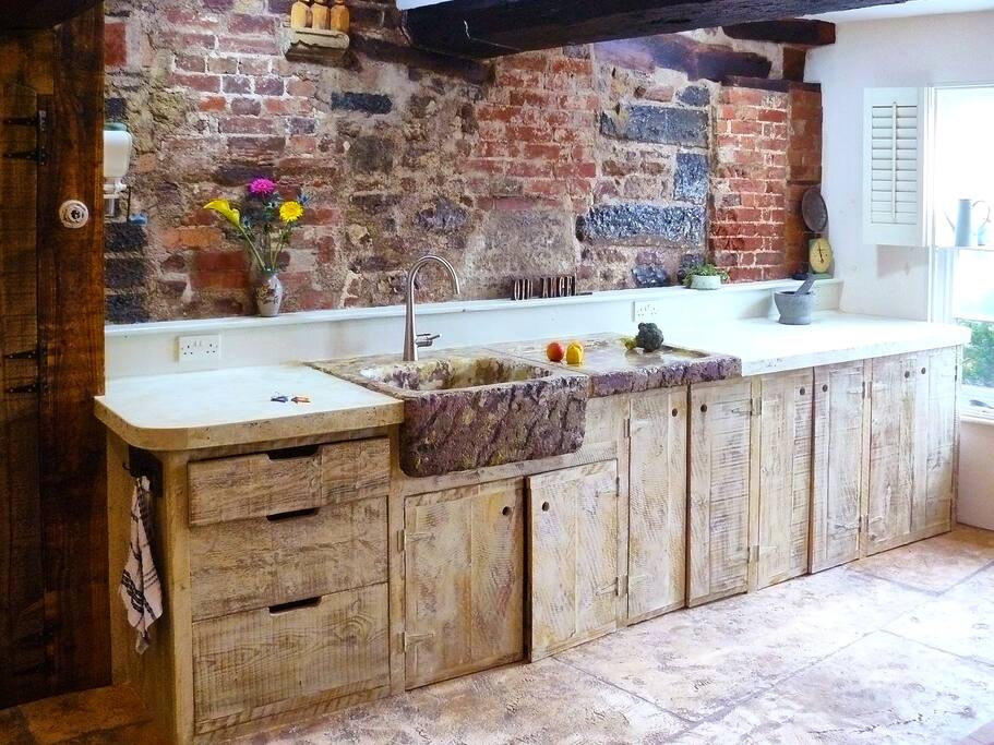 Hand built kitchen. Ancient wall