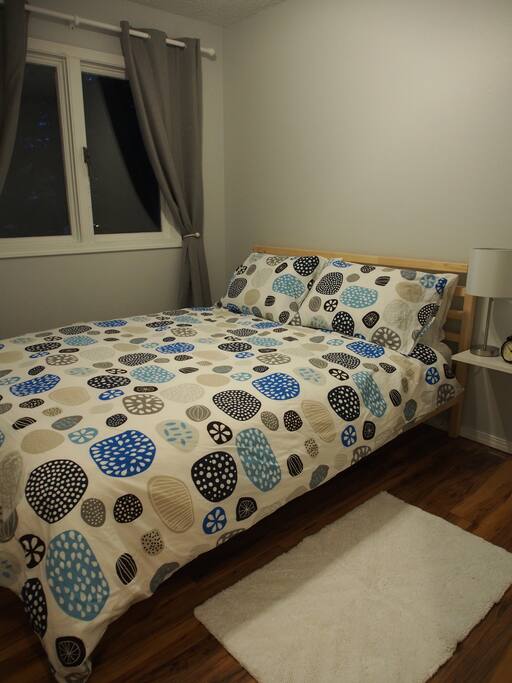 The Queen sized bedroom is nice and cozy! There are also blackout curtains on the window.