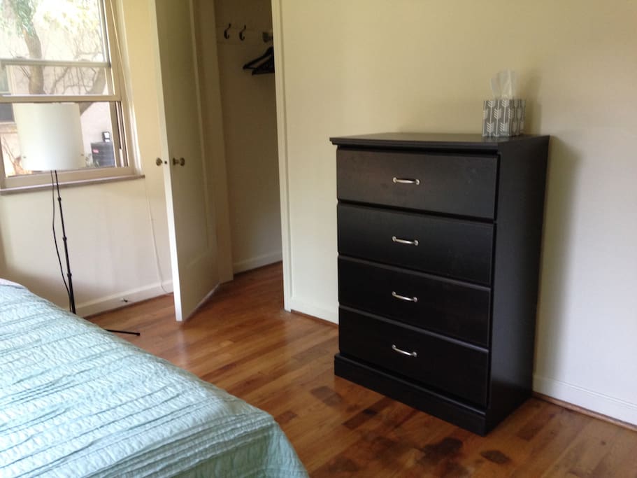 Dresser & closet with wooden hangers allow you to settle in for a longer stay.
