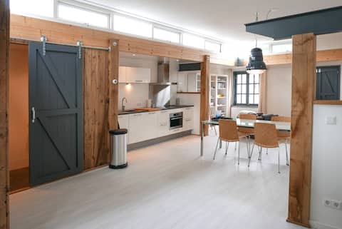 Unique loft in former workshop with garden.