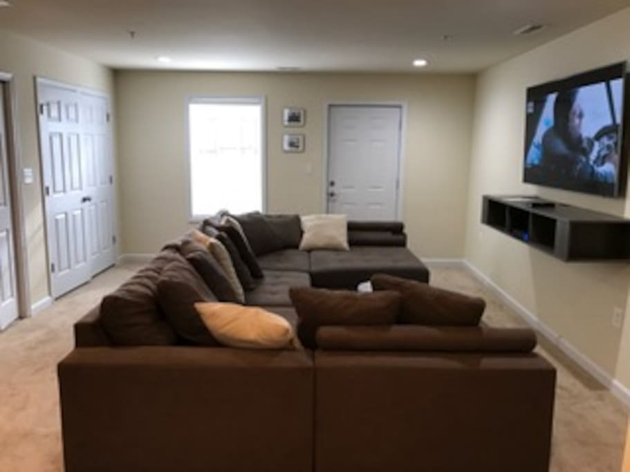 Large sectional couch in the living room- 70' inch Samsung with HBO GO, Netflix (Ultra Package) and Xfinity