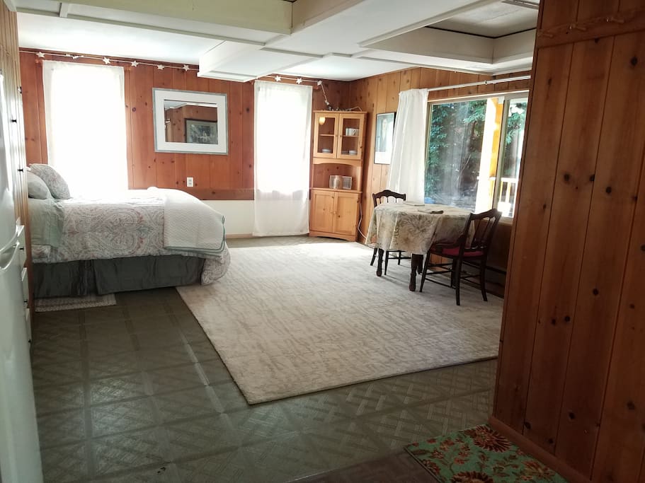 View from the kitchenette of sleeping area and dining table. The corner hutch holds all of your dishes.