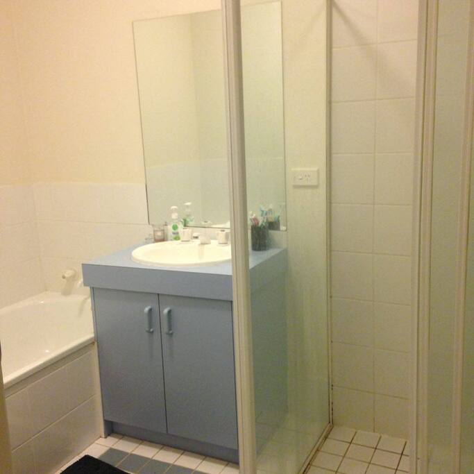 Bathroom with shower and bath
