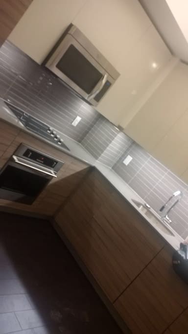 Kitchen area includes dishwasher & basic dishes