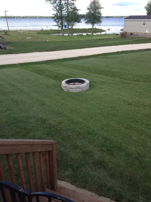 To the left of the fire pit is a huge grass field for playing sports or flying kites