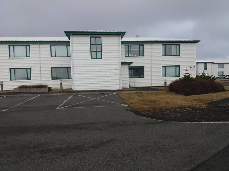 The entrance is on the right side of the house. Apartments F, G and C