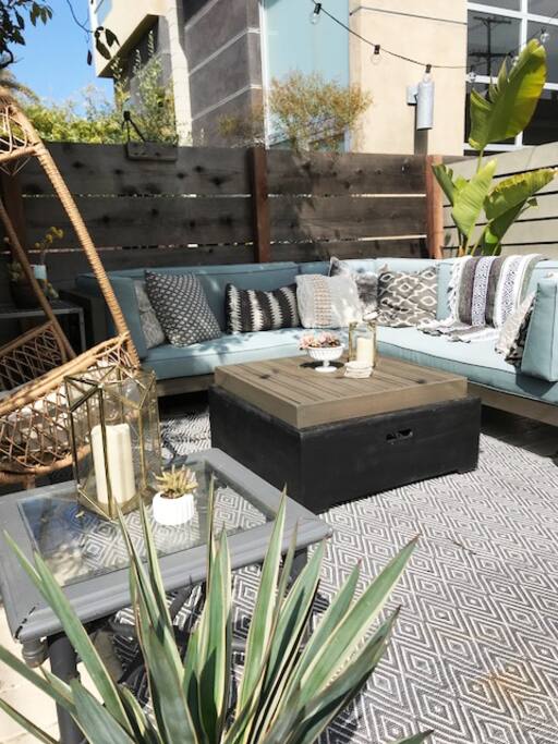 firepit table and outdoor lounge