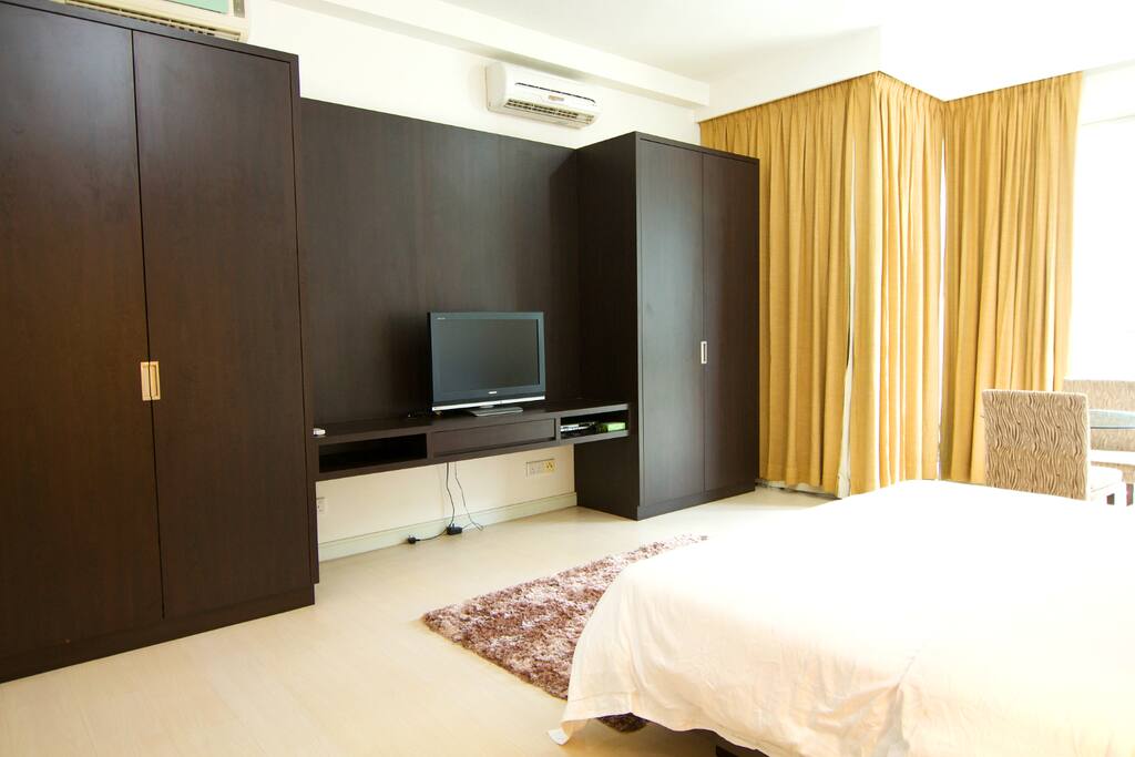 TV with two large wardrobes
