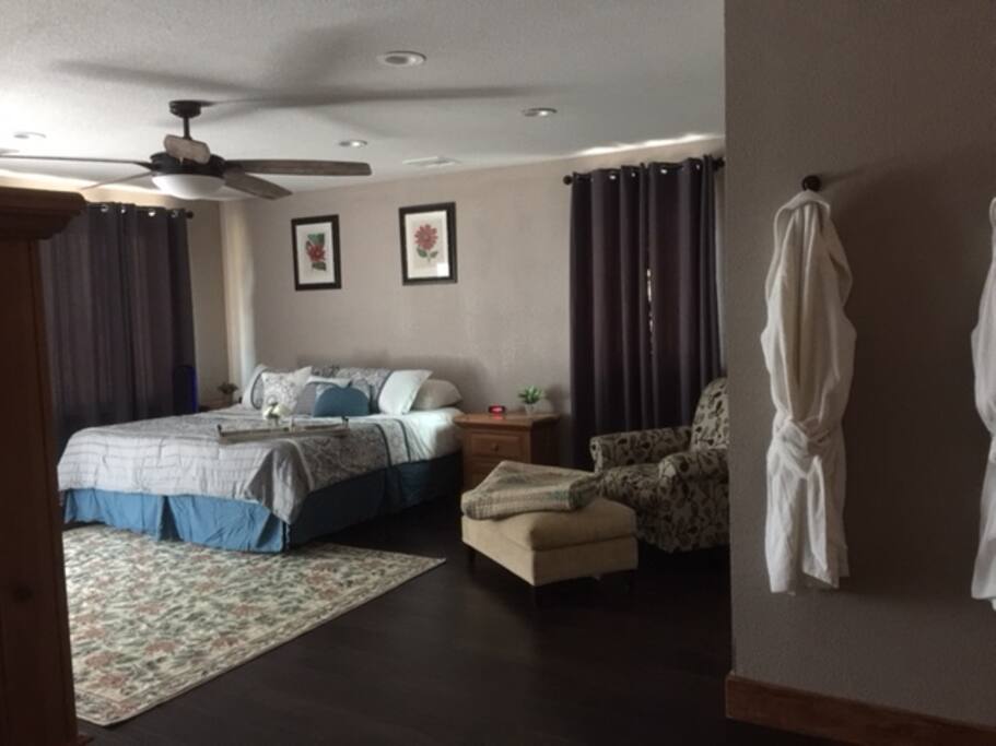 Large Master Bedroom with a luxury adjustable king bed with massage settings for the best nights sleep with a 70 inch large screen TV. You will only need to leave the bedroom when you need food!