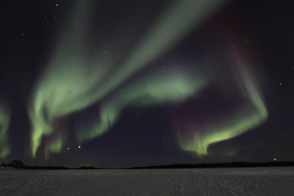 View of Northern Lights from Torne River, a one minute walk from cottage door