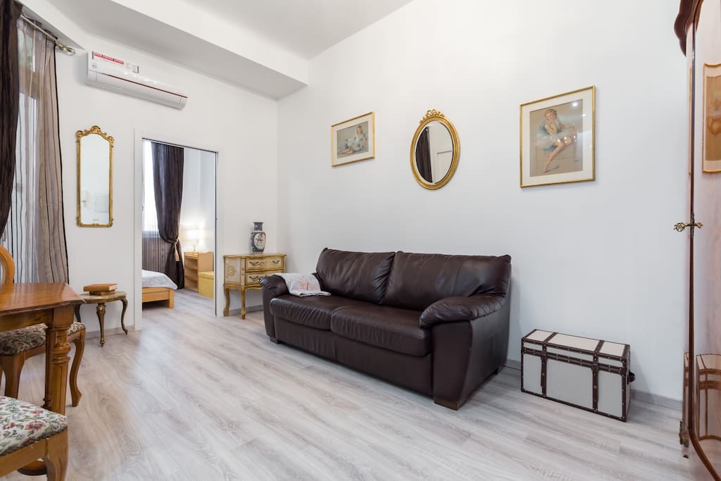 Living room decorated with nice antique pieces, but wi-fi is there anyway)