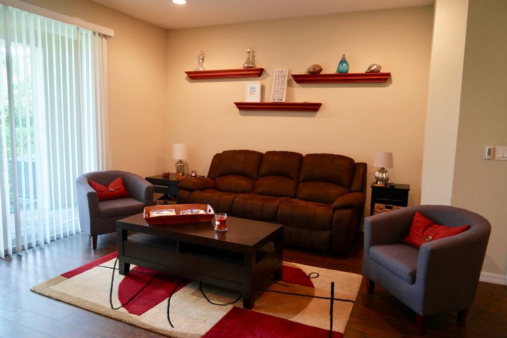 Cozy living room with ample sitting to relax after a day at the beach.