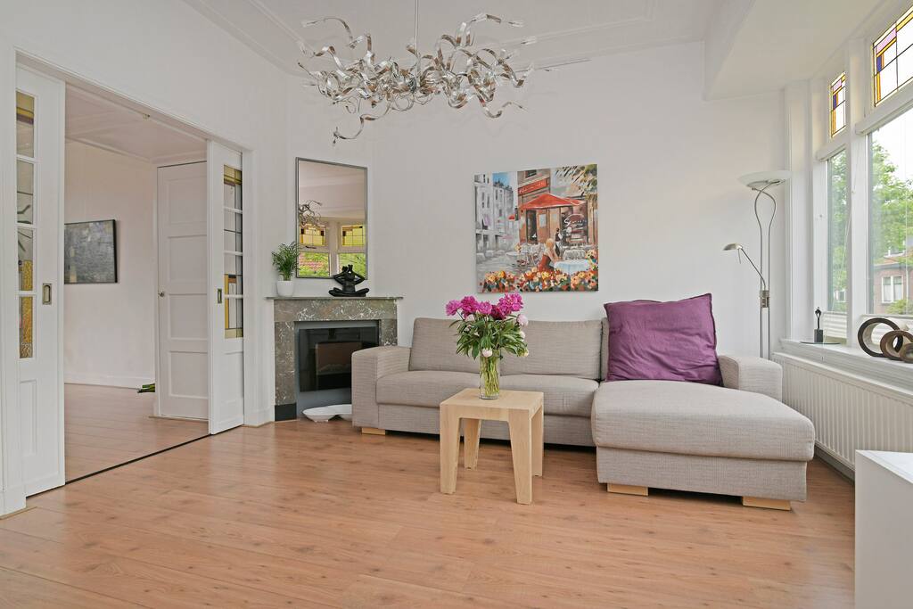 Sunny living room with large couch