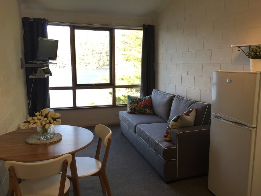 Combined living and dining room - lounge is a sofa bed.