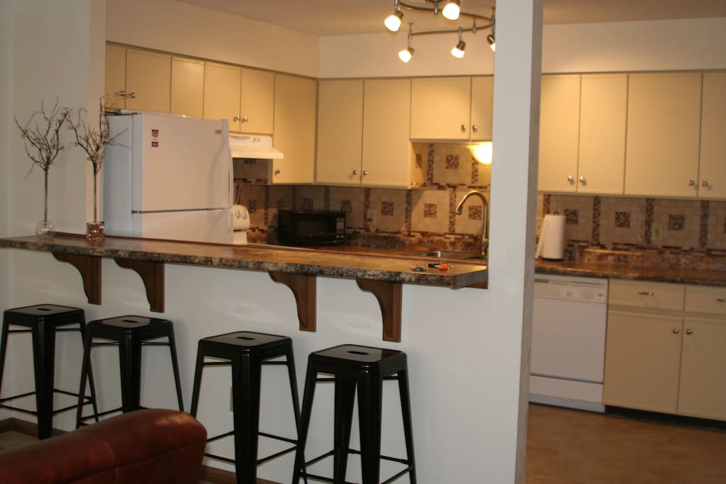 The breakfast bar seats 4. We have additional seating for 2 at the rolling table, and a fold away toddler table that seats 4.