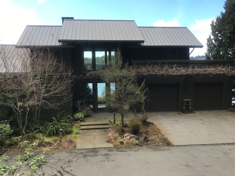 Front of house, plenty of parking in the driveway and across the street on our private lane as well as one spot in the direct access garage