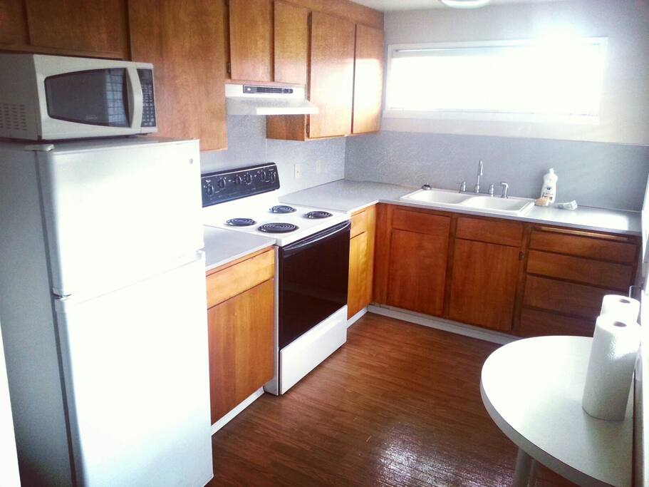 Full kitchen with coffee maker, utensils, microwave/owen, refrigerator