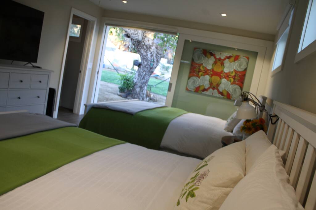 Bedroom with view of backyard.