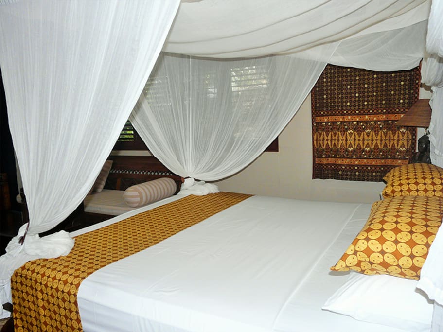 Deluxe Room (Lotus Room) with tropical outdoor shower and private garden.