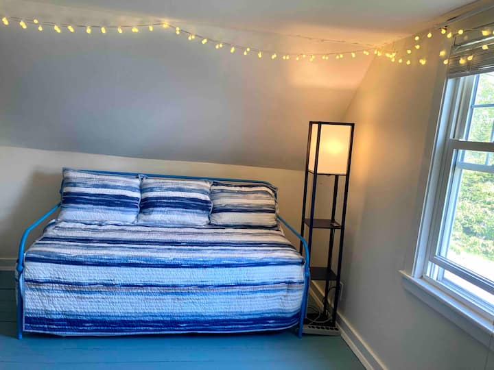 The upstairs twin daybed has a trundle that pulls out and stays low near the floor. There are new hybrid mattresses. The lighting will be around the ceiling. :)

A fun place to hang out even if staying here solo!