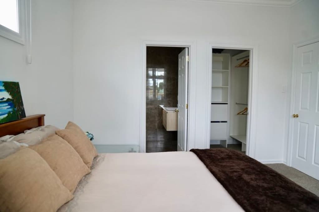 The bedroom is complemented with a walk in wardrobe and a private shower, toilet and vanity mirror