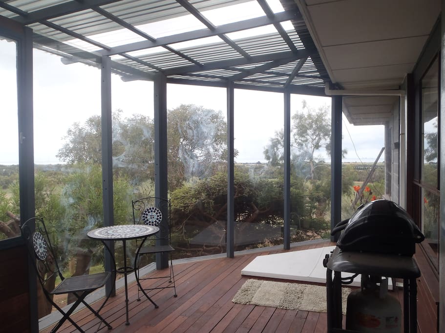Guest private decking area with sunken spa bath, BBQ and fantastic views