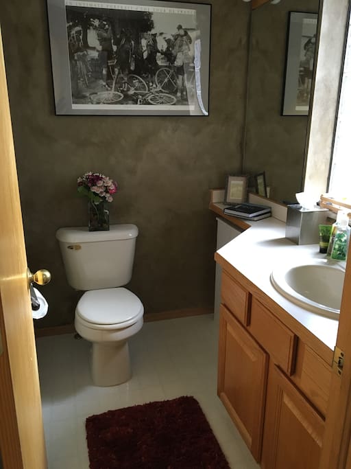 Powder room next to kitchen