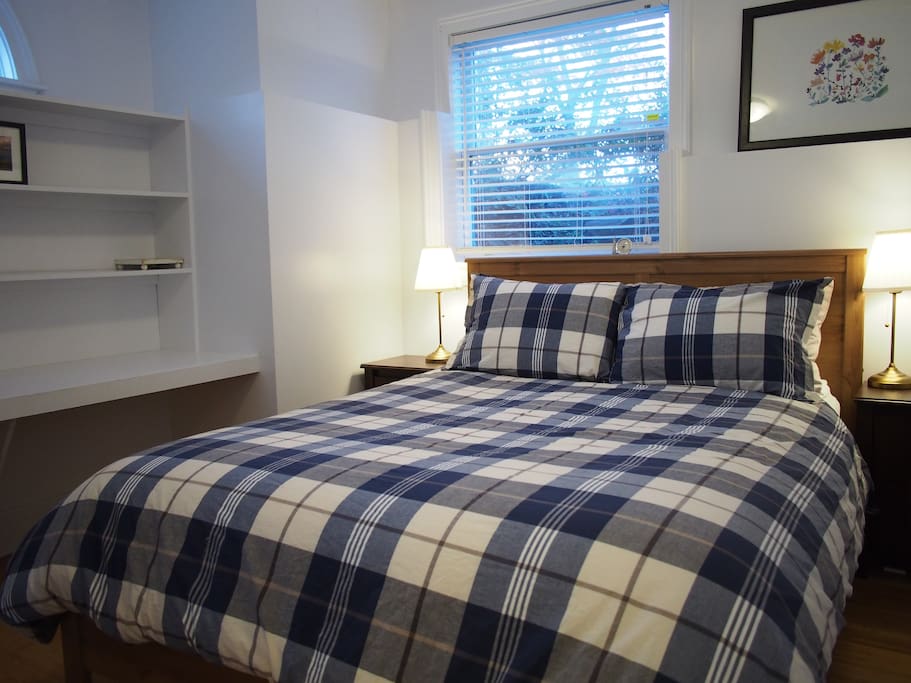Cozy bedroom with queen bed.