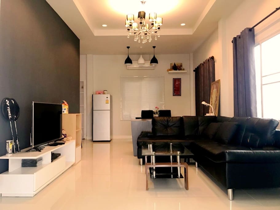 In the living room with sofe sofa that you can relax and take a nap and glass table. The refrigerator can make ice-cream. There are air conditions in living room and 2 bedrooms. The TV can use if you have hospot wifi.